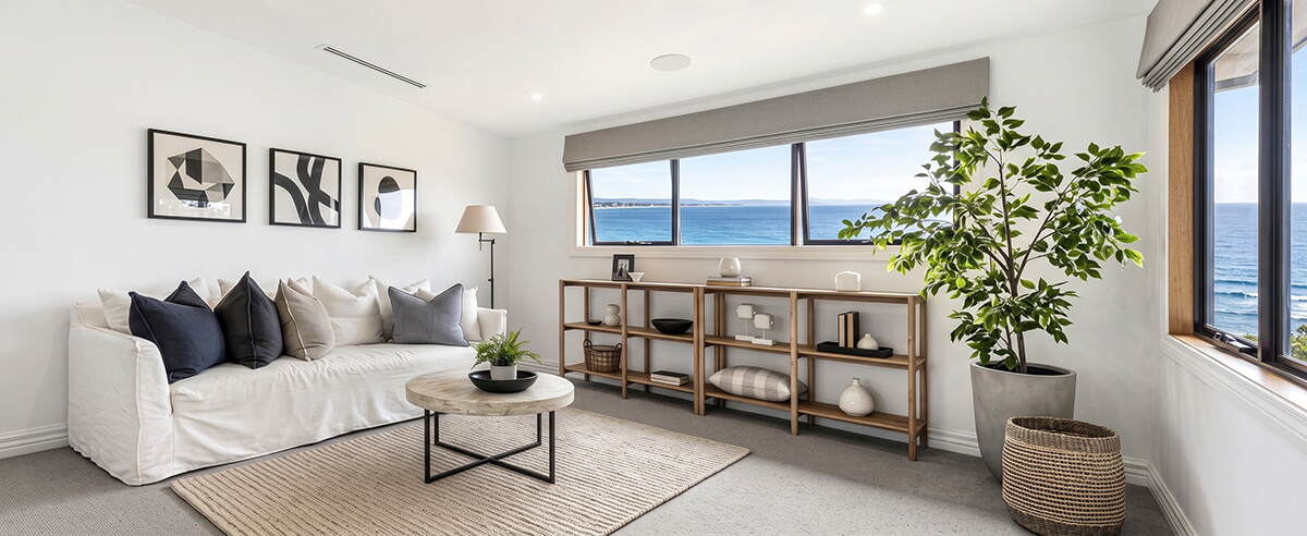 coastal-living-room-aluminum-awning-windows-ocean-view