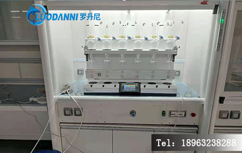 一台LDN-1006智能型自动液液萃取仪的工作舱特写，可清晰看到数个样品在密闭空间中同时进行涡旋震荡萃取，无溶剂外露