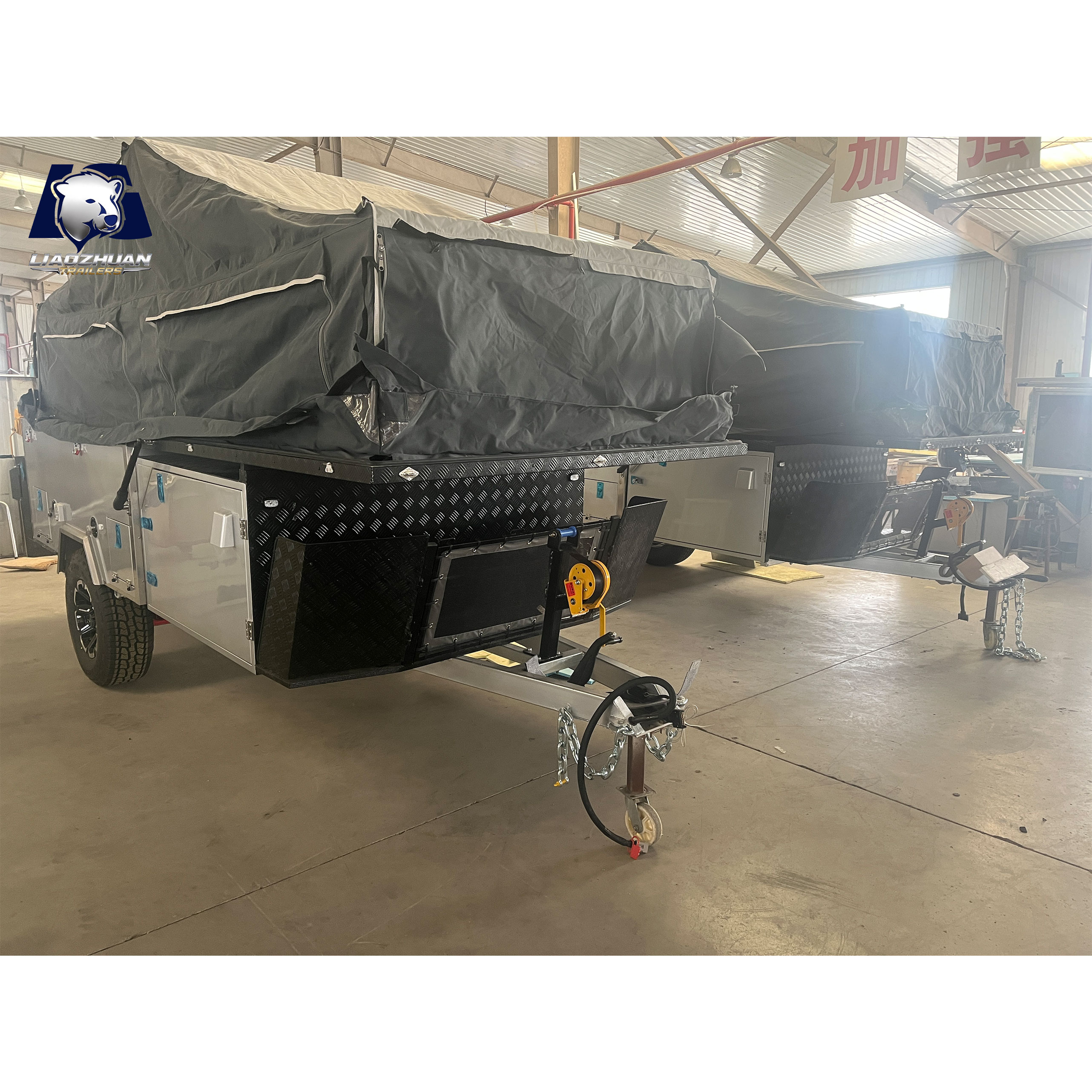 Front-folding hard-floor camping trailer