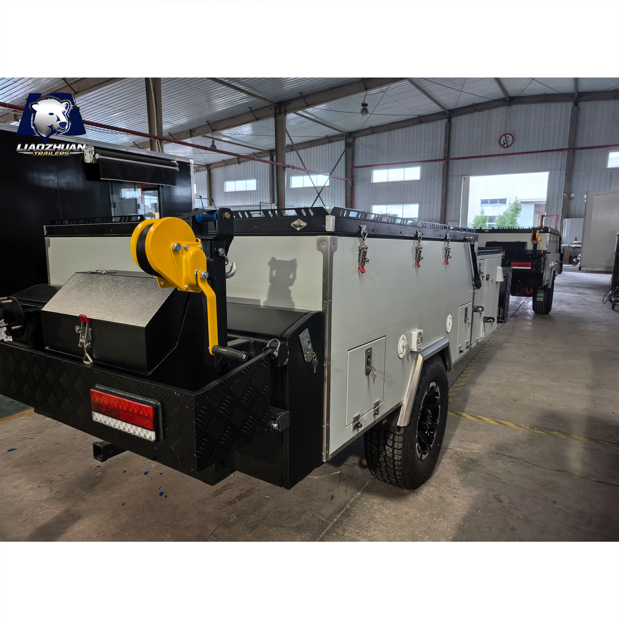 Front-folding hard-floor camping trailer