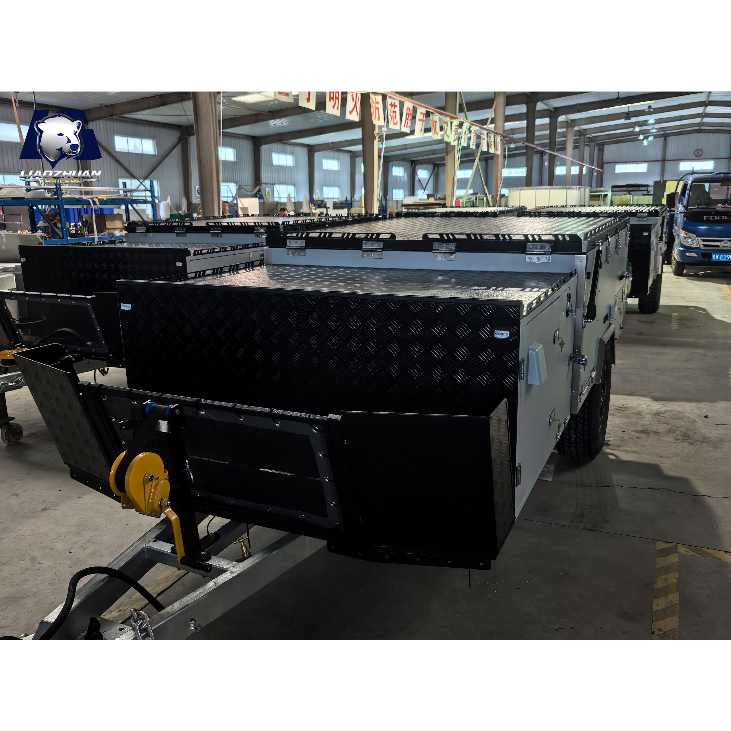 Front-folding hard-floor camping trailer