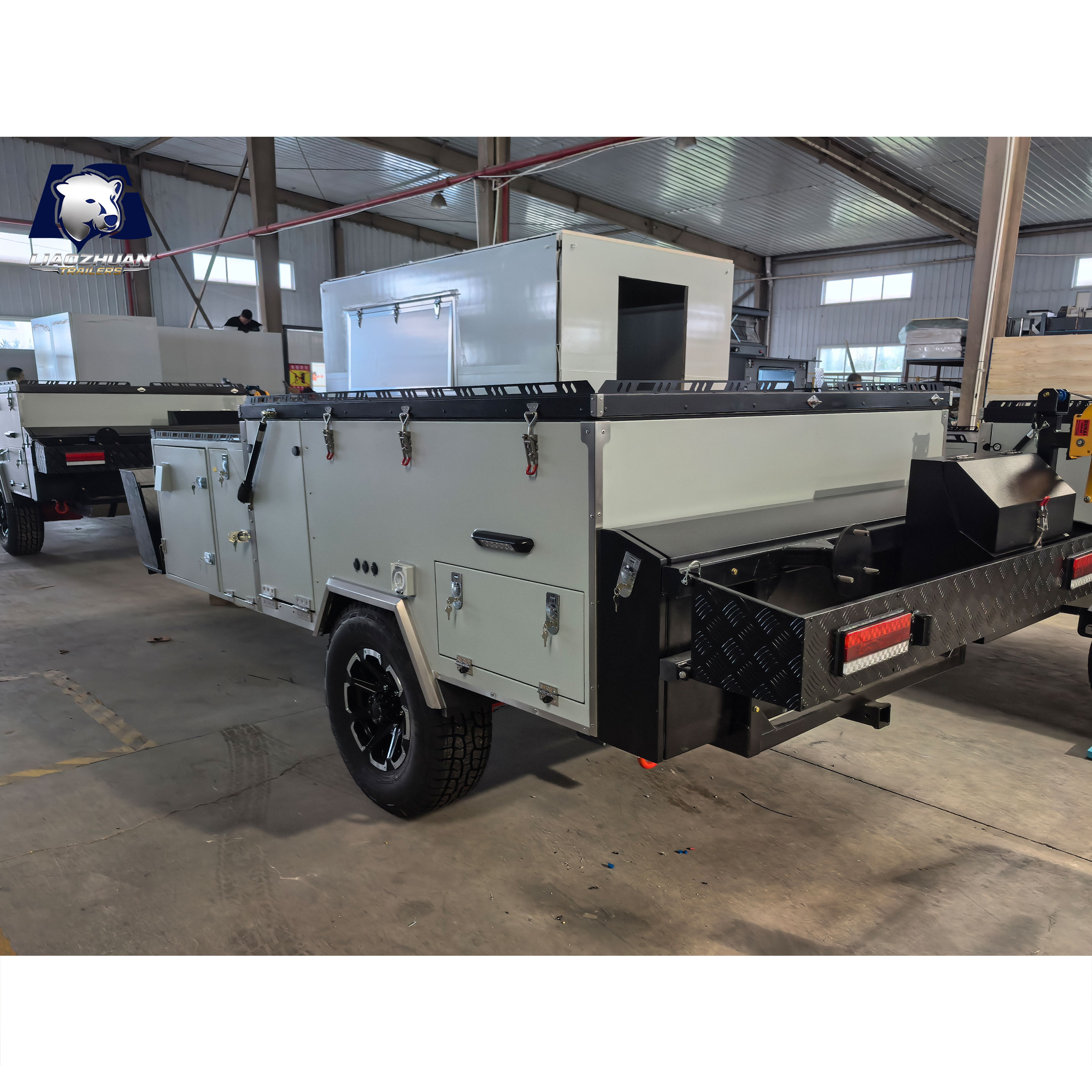 Front-folding hard-floor camping trailer