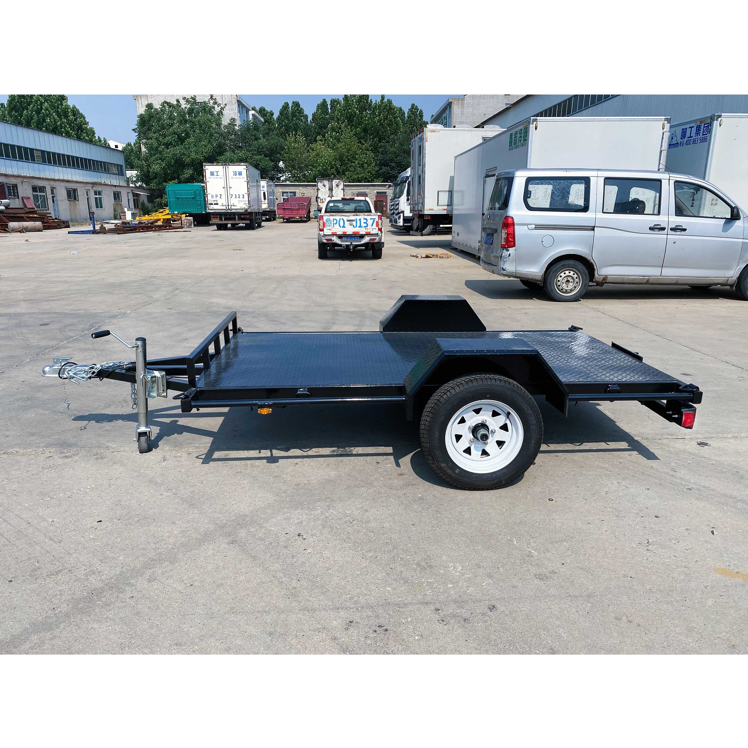 Single axle black flatbed trailer
