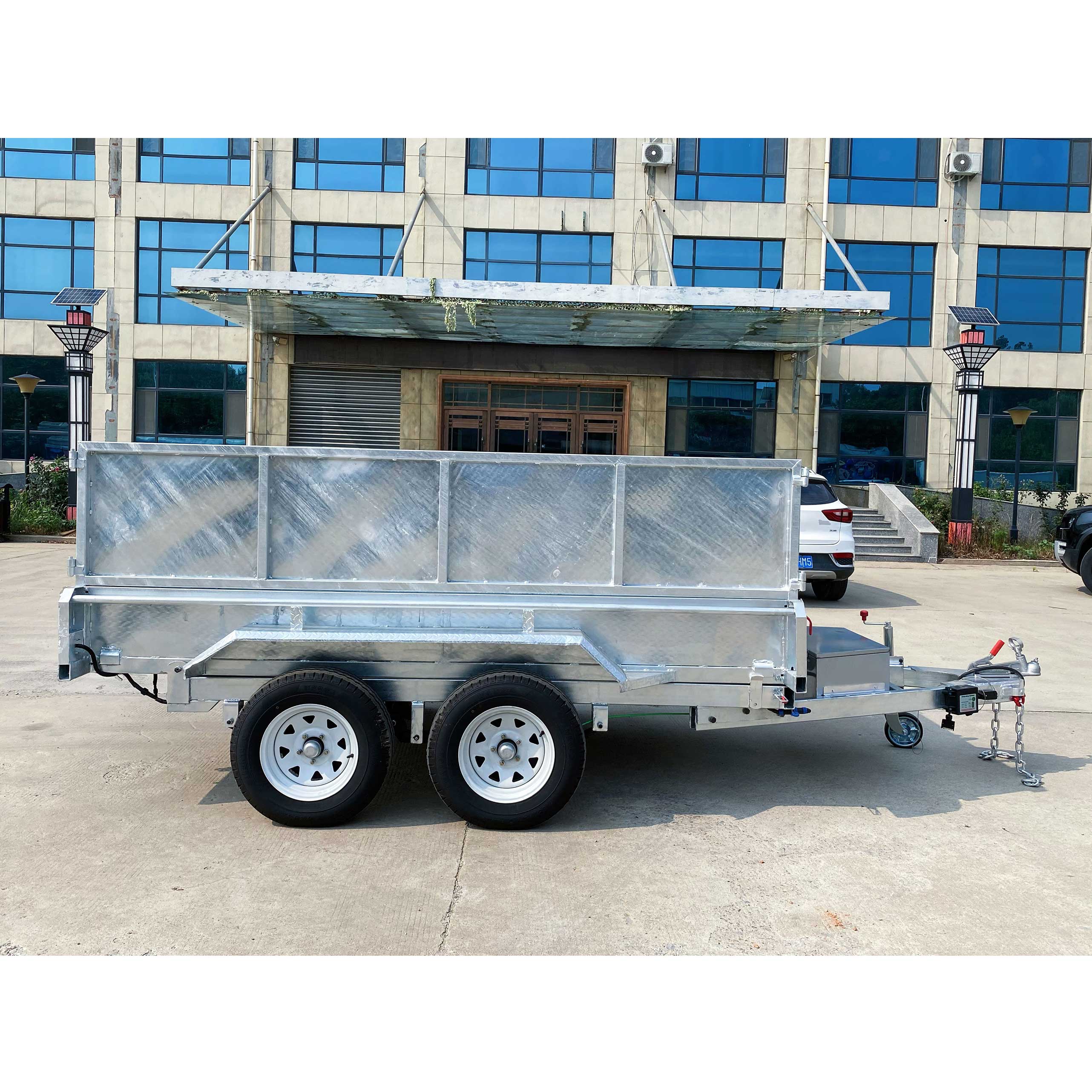 Double-box type self-unloading hydraulic agricultural trailer