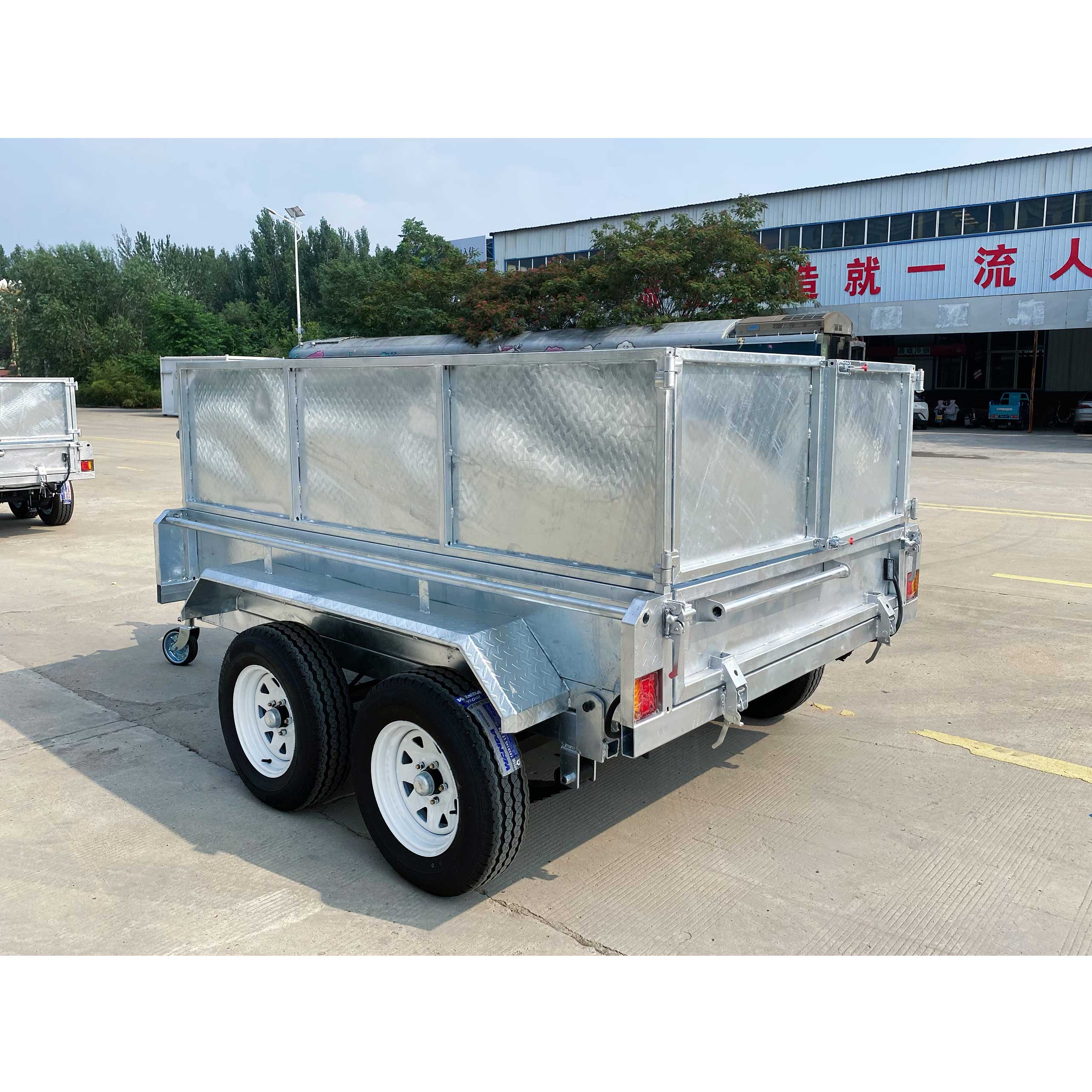 Double-box type self-unloading hydraulic agricultural trailer