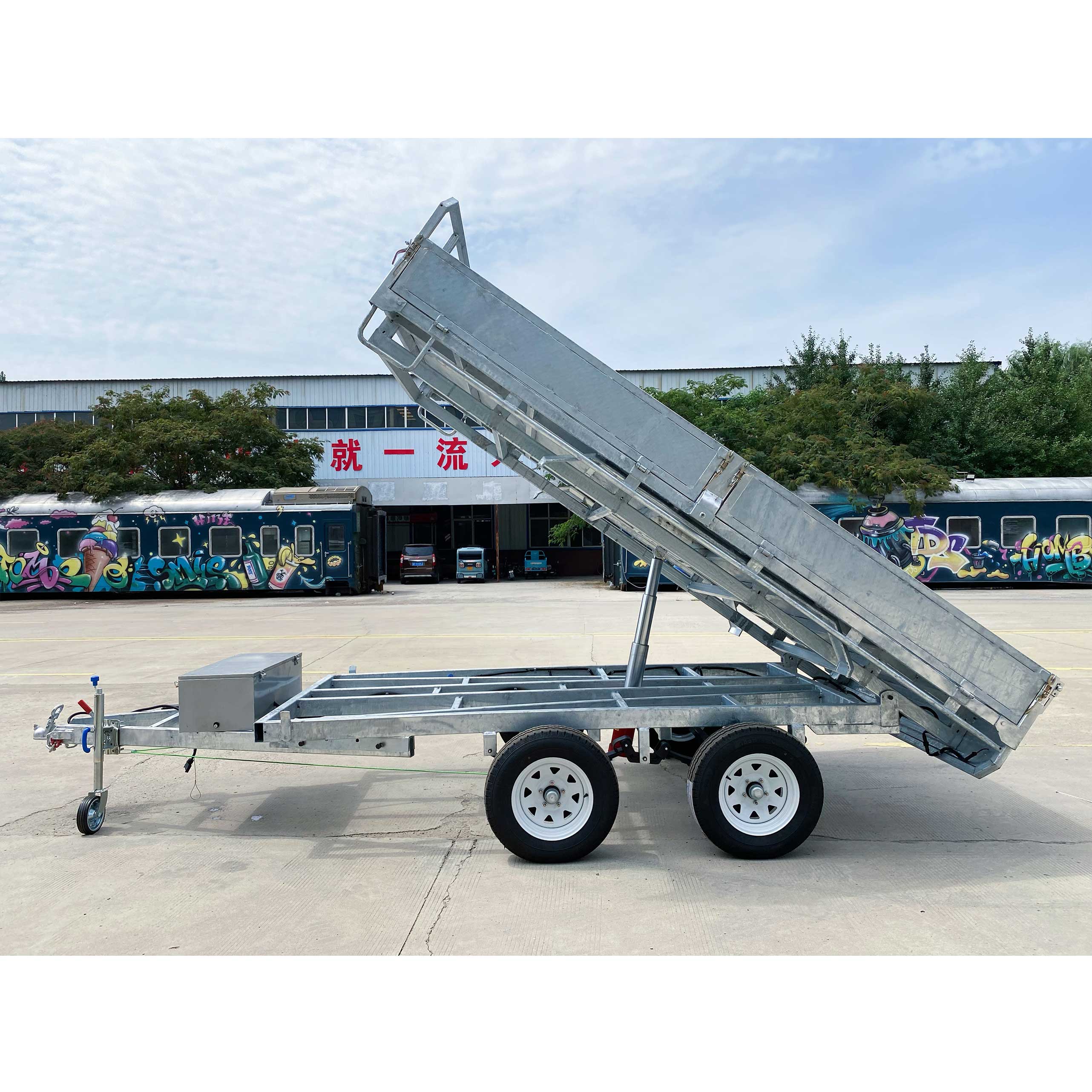 Series-connected dual-axis self-unloading hydraulic trailer