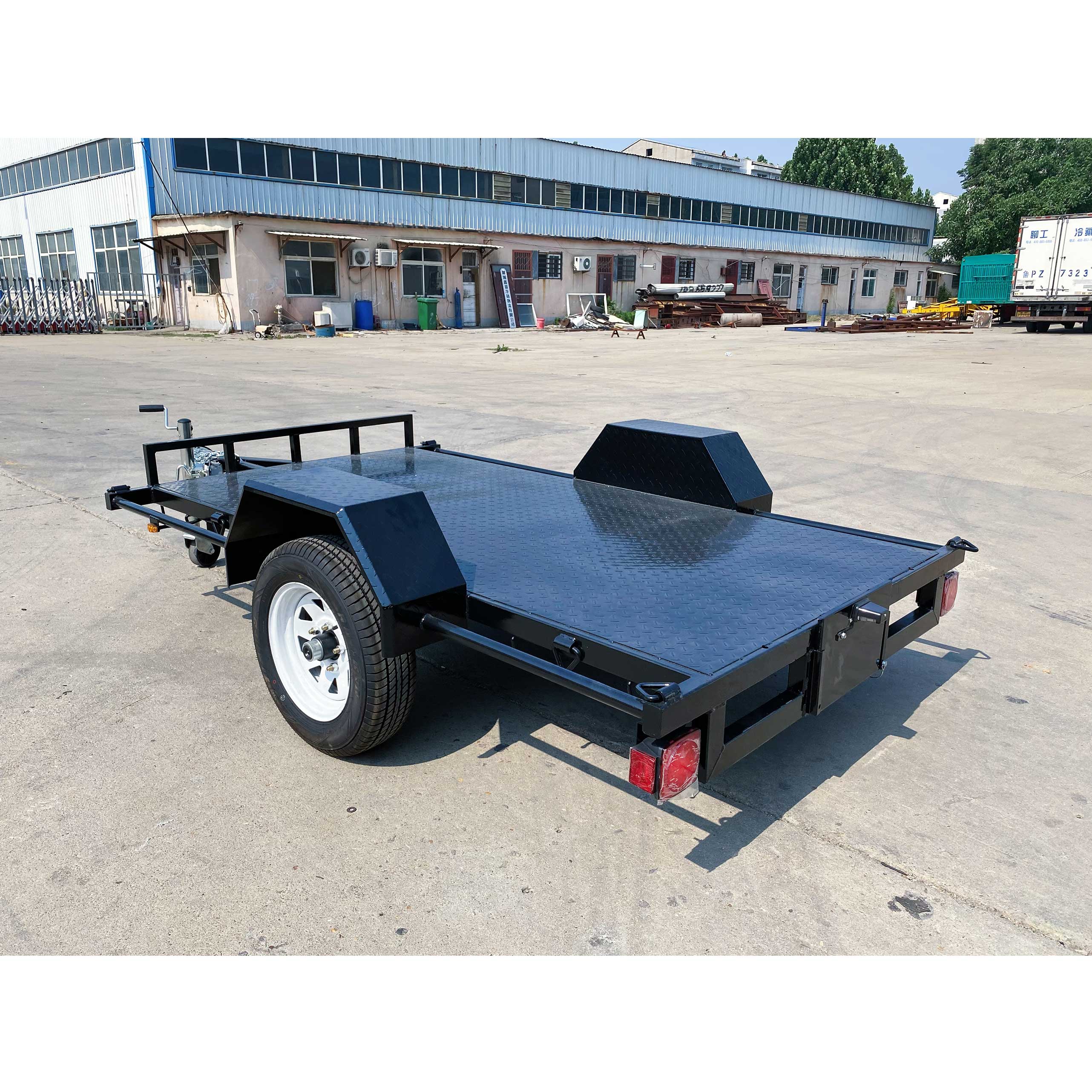 Single axle black flatbed trailer