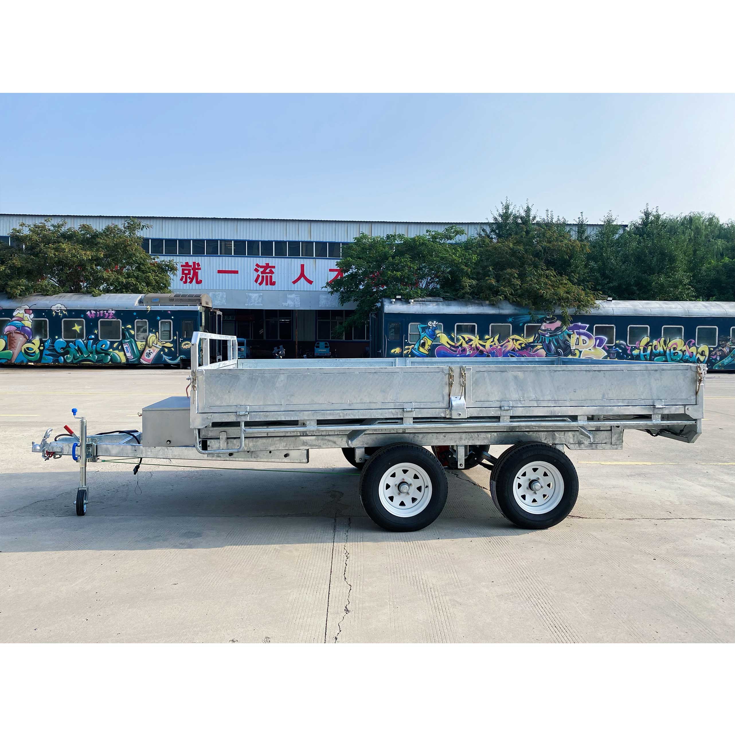 Series-connected dual-axis self-unloading hydraulic trailer