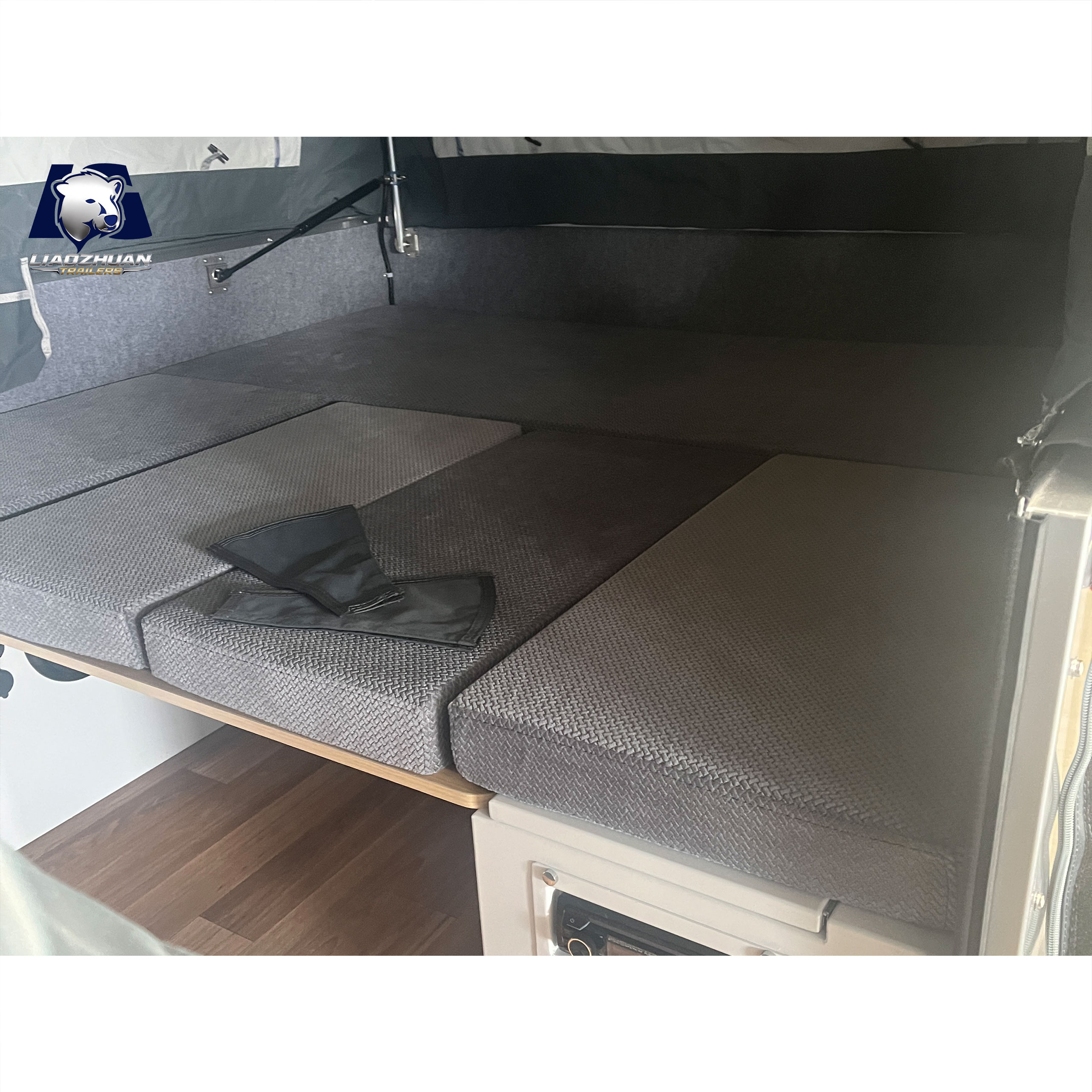 Front-folding hard-floor camping trailer