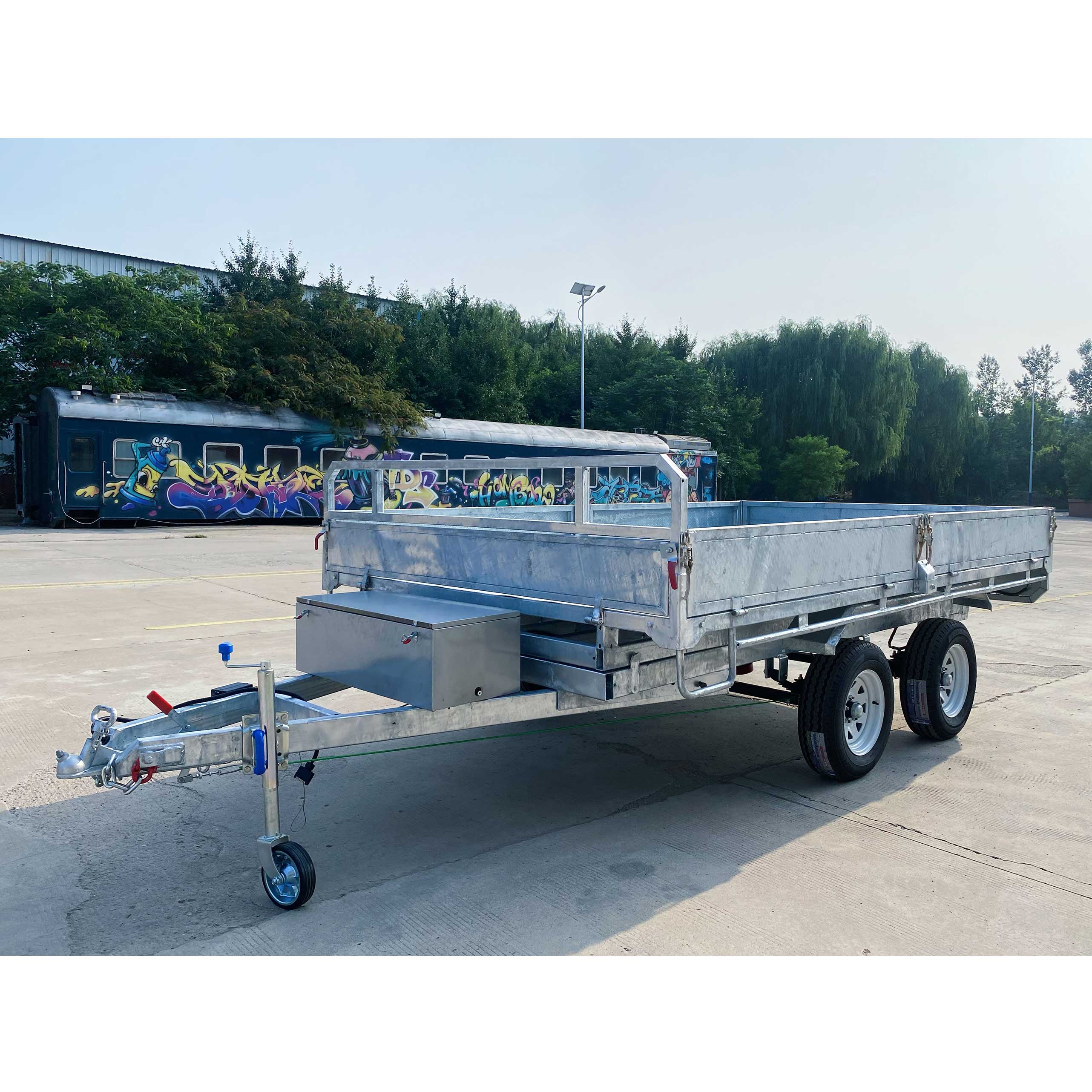 Series-connected dual-axis self-unloading hydraulic trailer