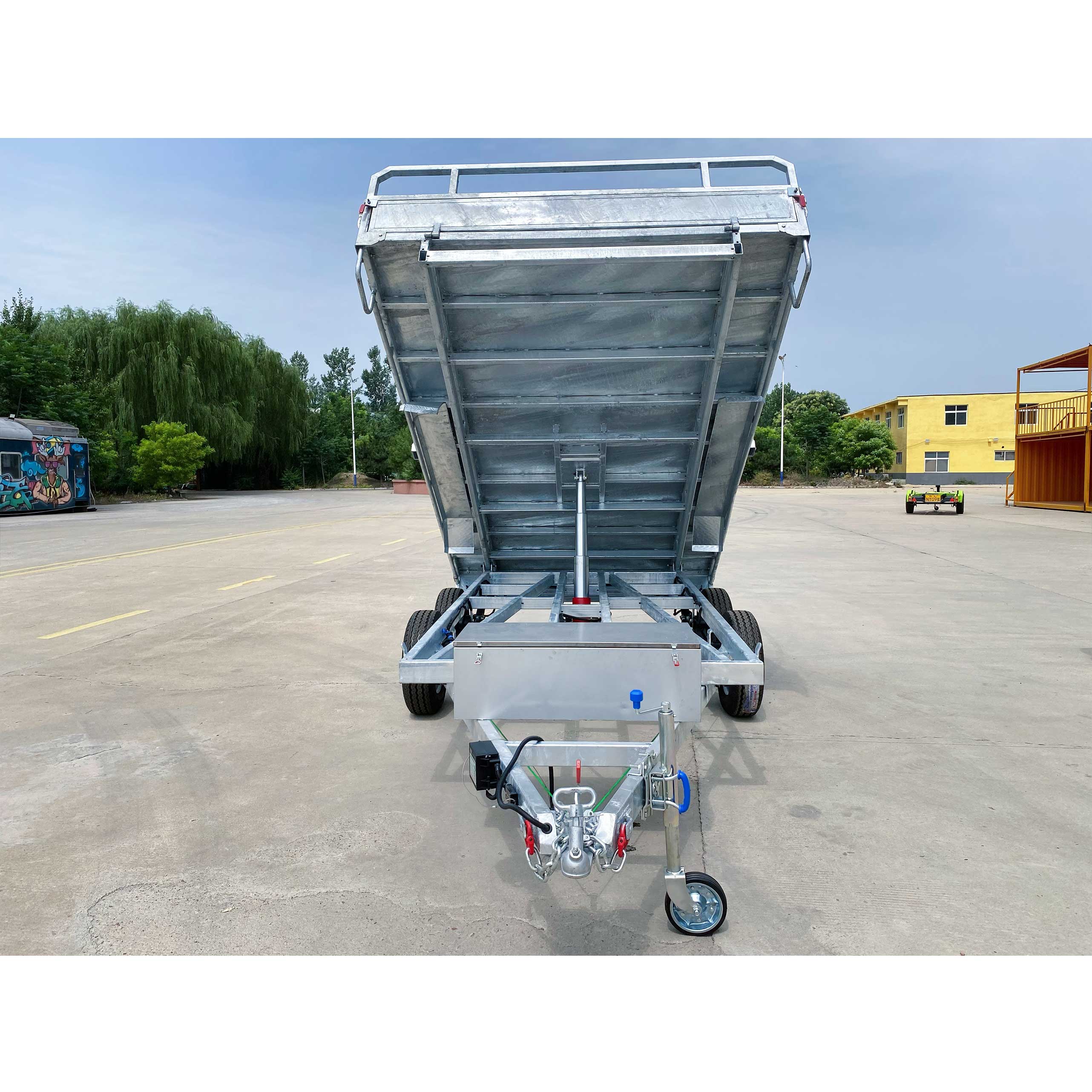 Series-connected dual-axis self-unloading hydraulic trailer