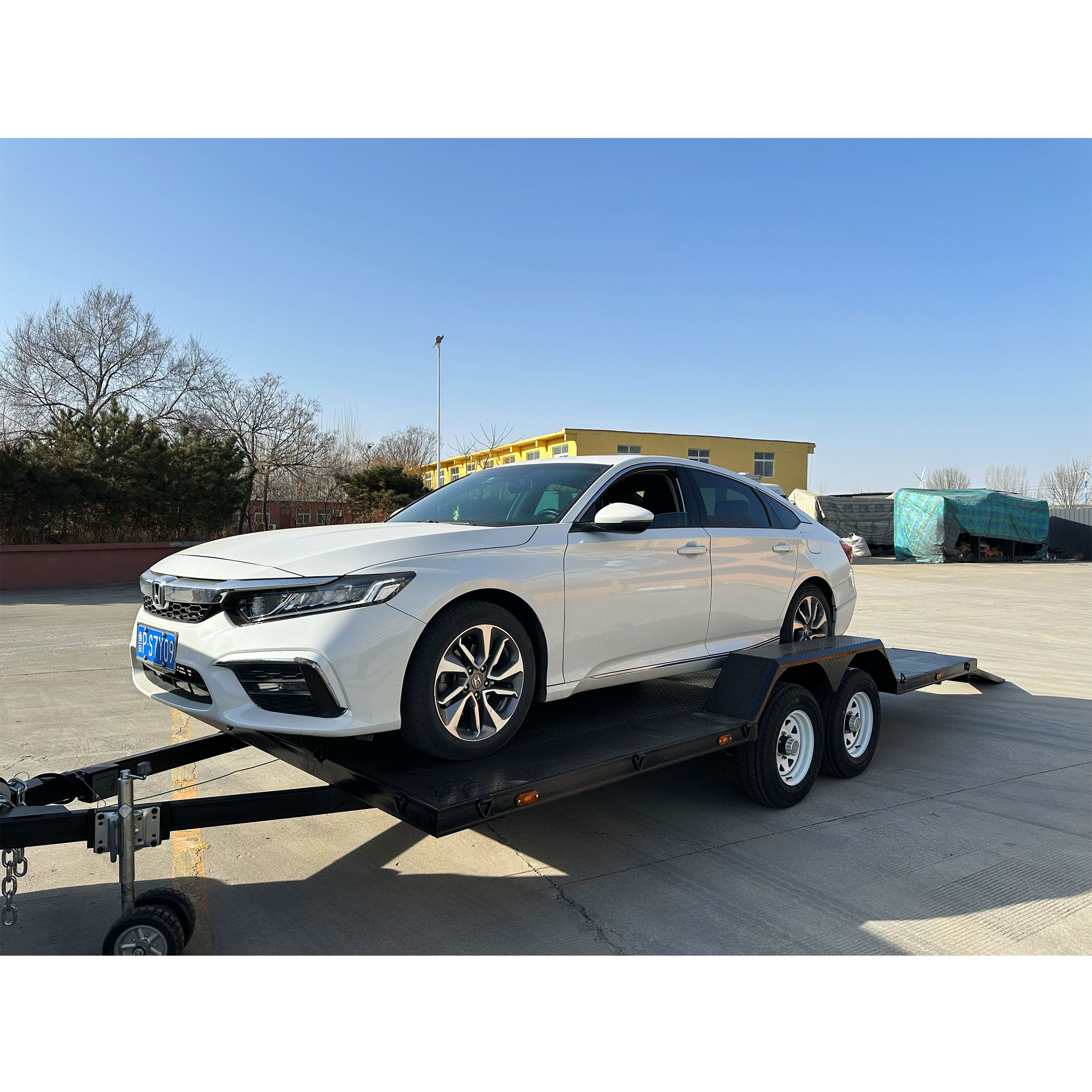 Dual-axle black painted car trailer