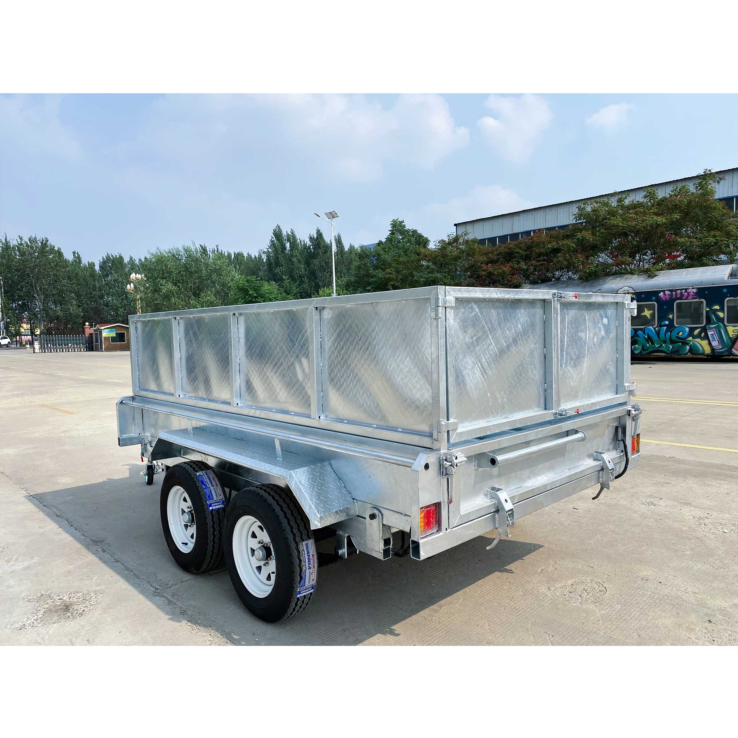 Double-box type self-unloading hydraulic agricultural trailer