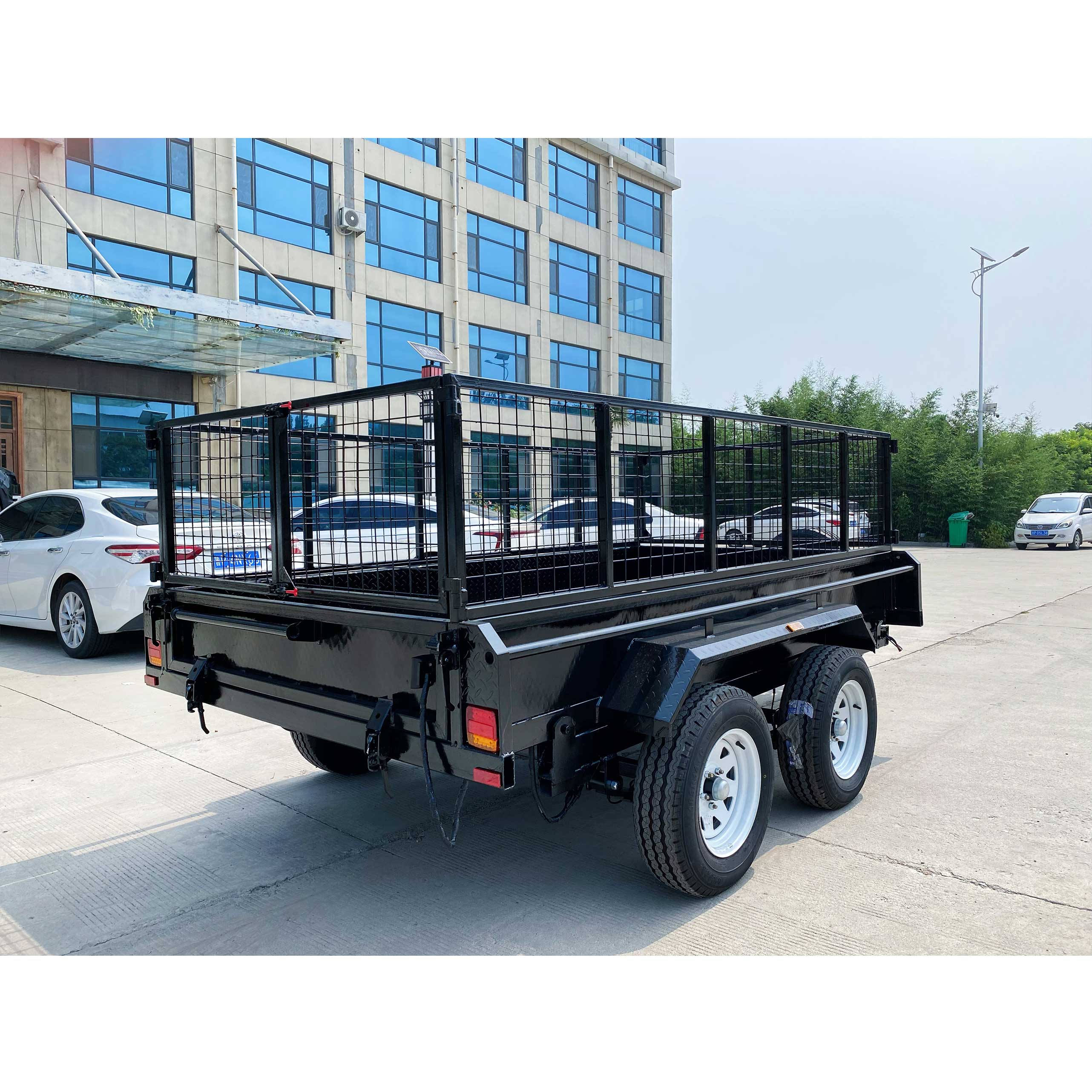 Double-axis black cage-type hydraulic dump truck trailer