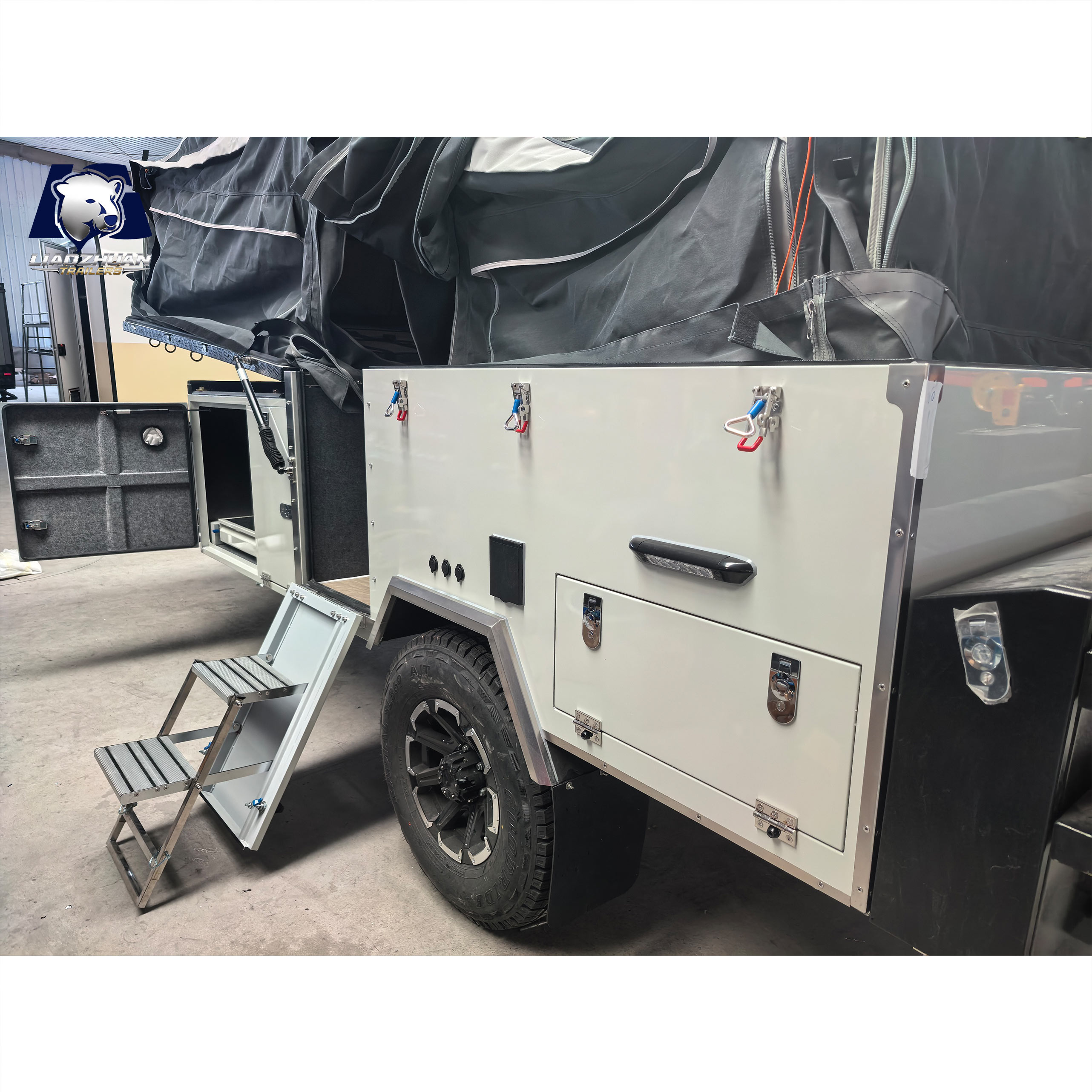 Front-folding hard-floor camping trailer