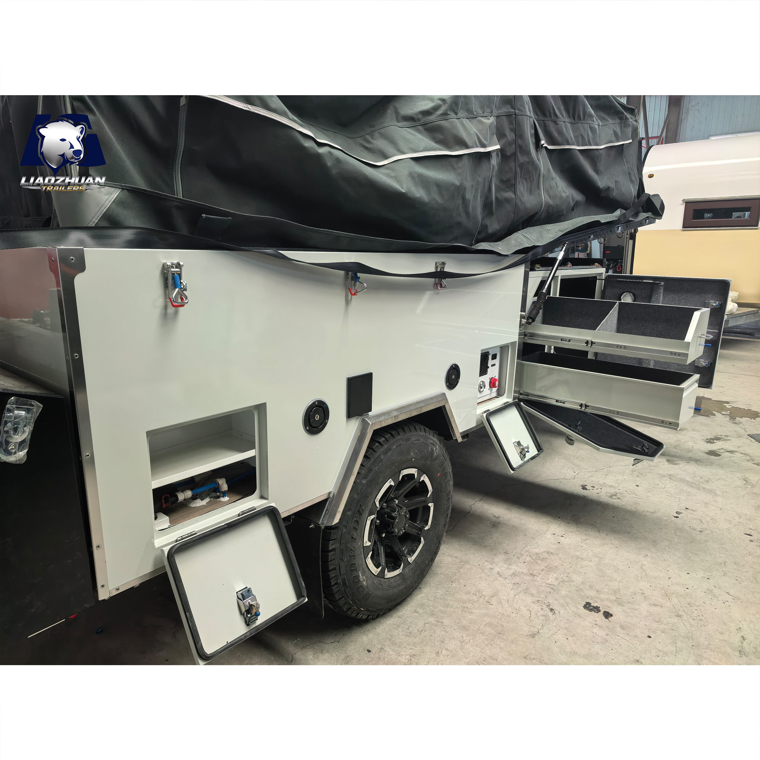 Front-folding hard-floor camping trailer
