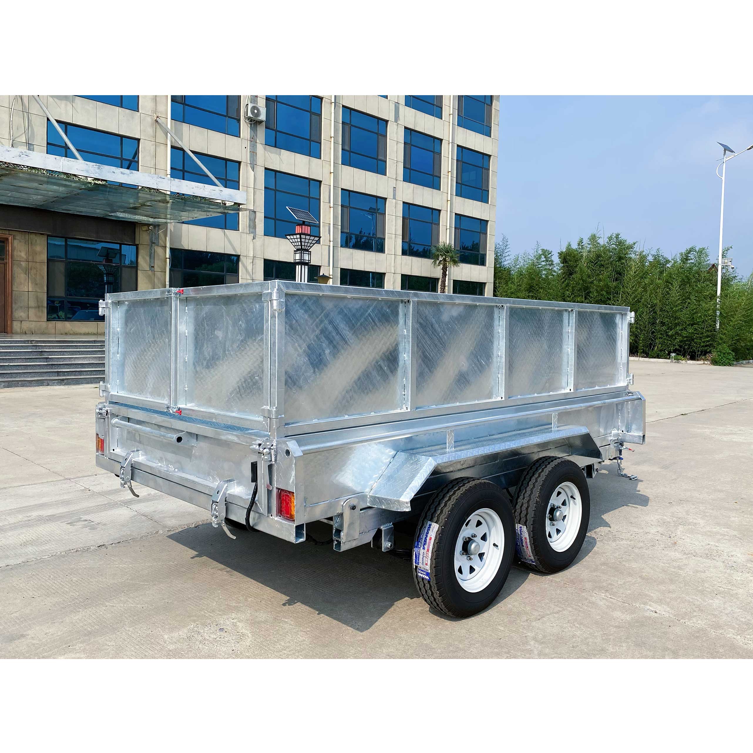 Double-box type self-unloading hydraulic agricultural trailer
