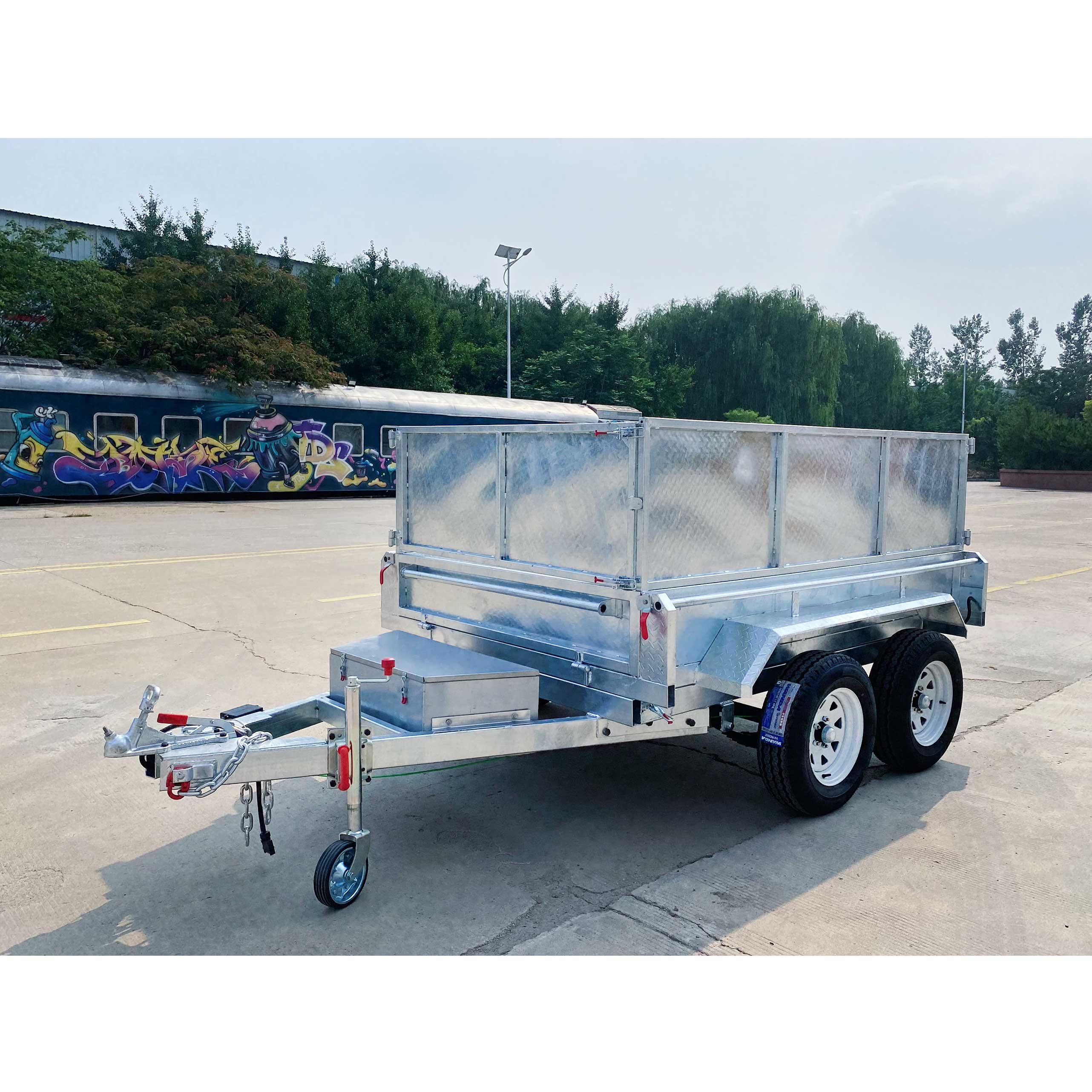 Double-box type self-unloading hydraulic agricultural trailer