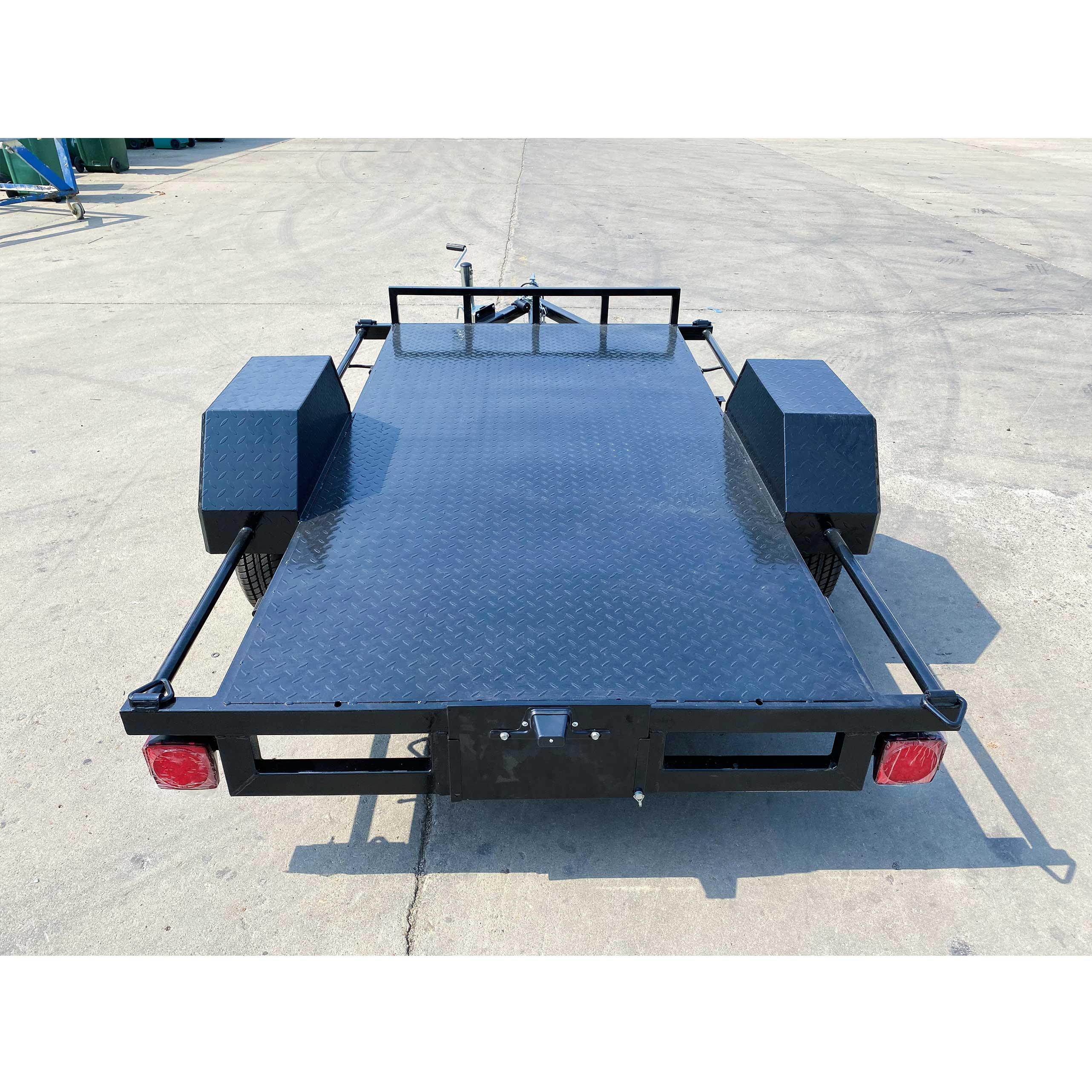 Single axle black flatbed trailer