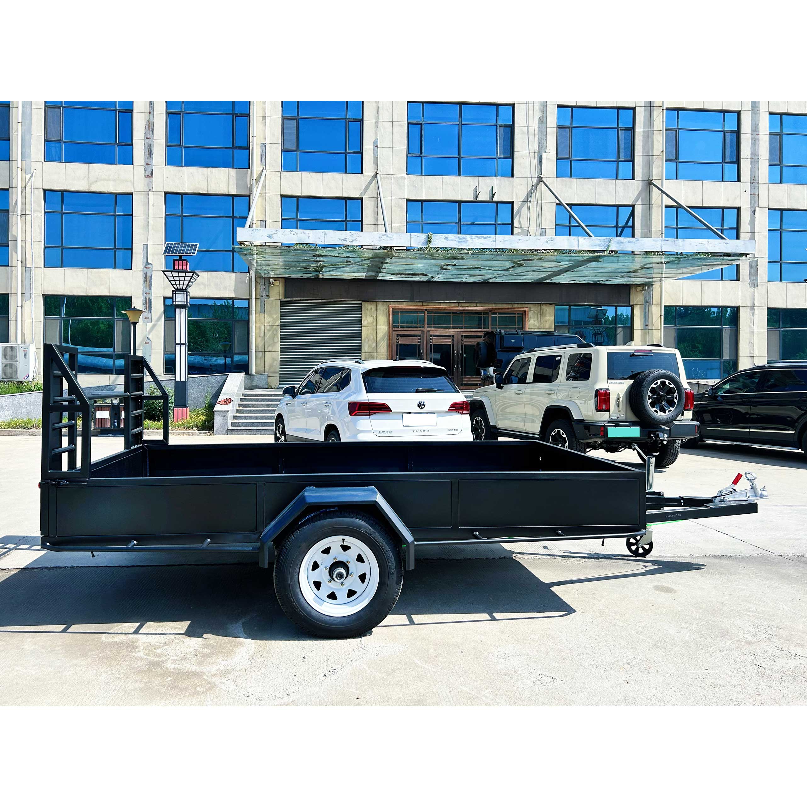 Agricultural fence truck trailer with mid-mounted axle for towing goods trailer