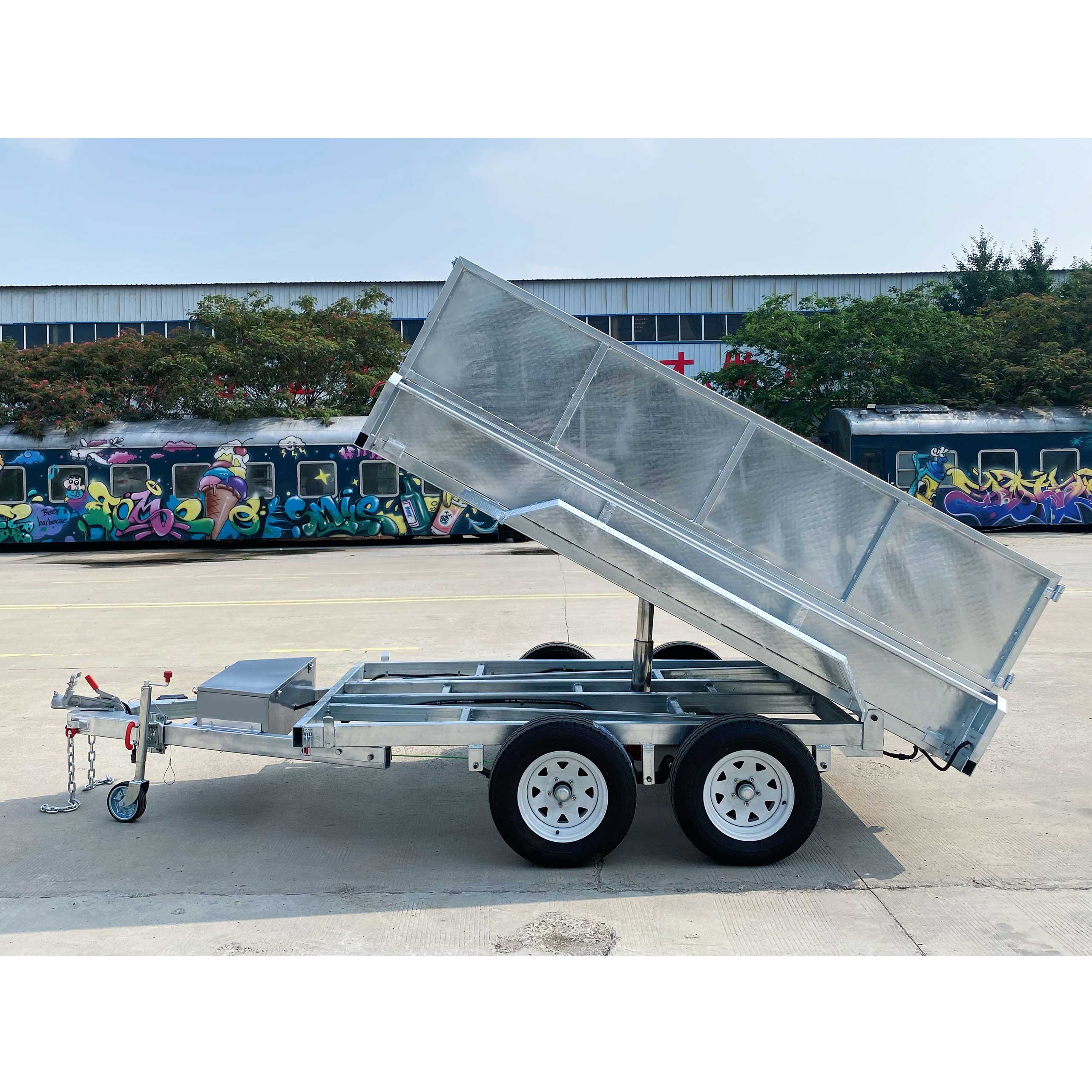 Double-box type self-unloading hydraulic agricultural trailer