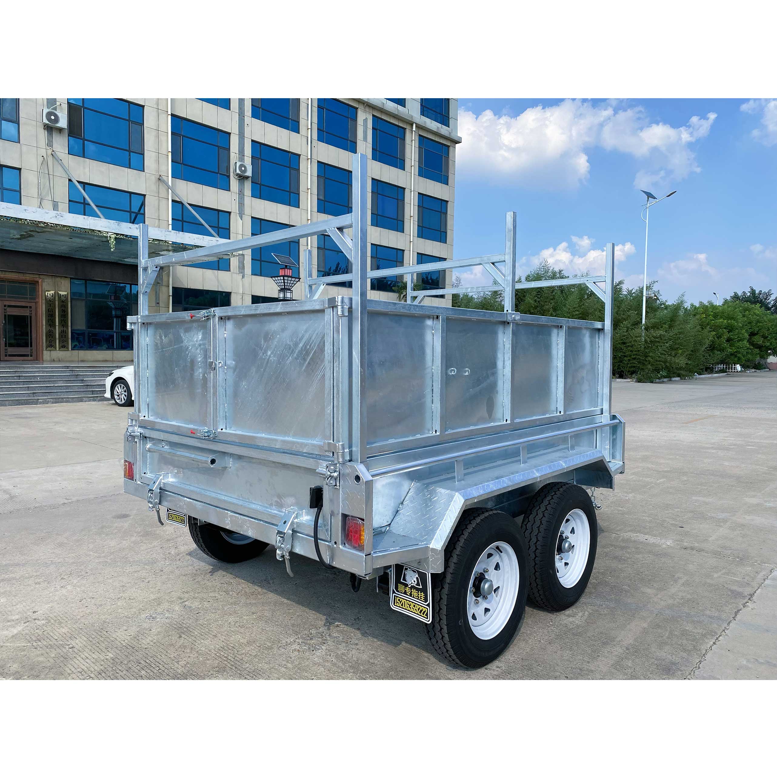 Double-axis dump box trailer