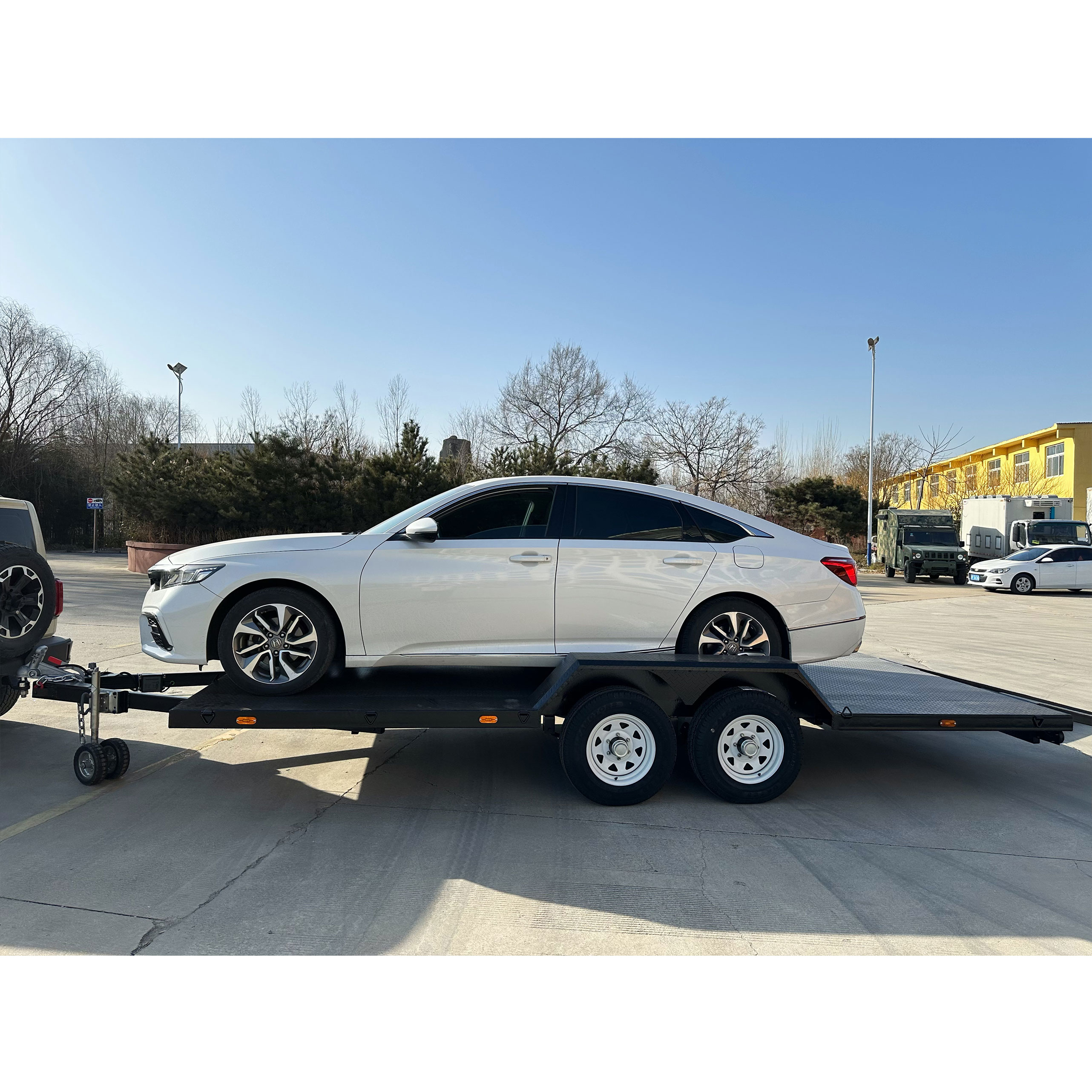 Dual-axle black painted car trailer