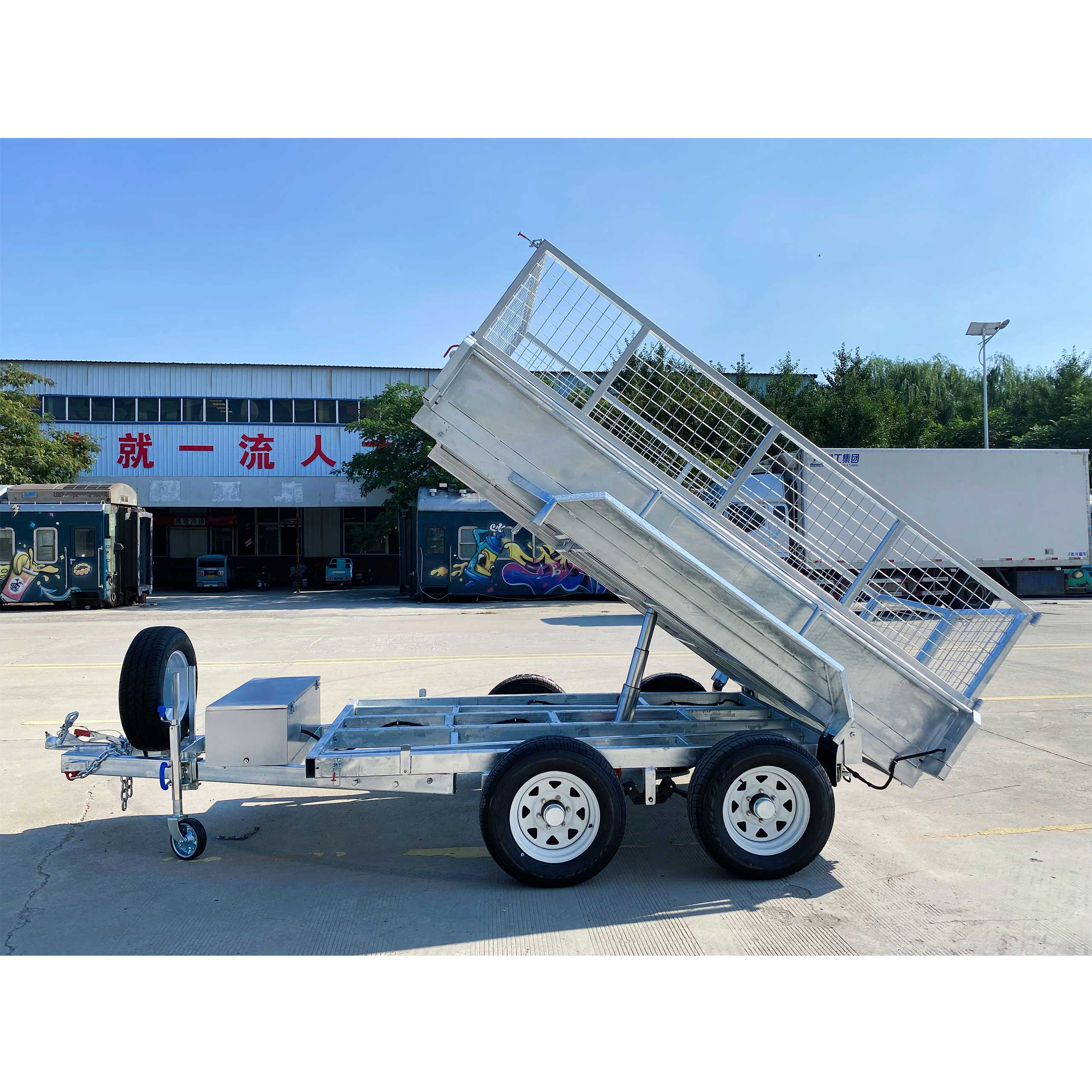 Double-axis tipping cage trailer with tires