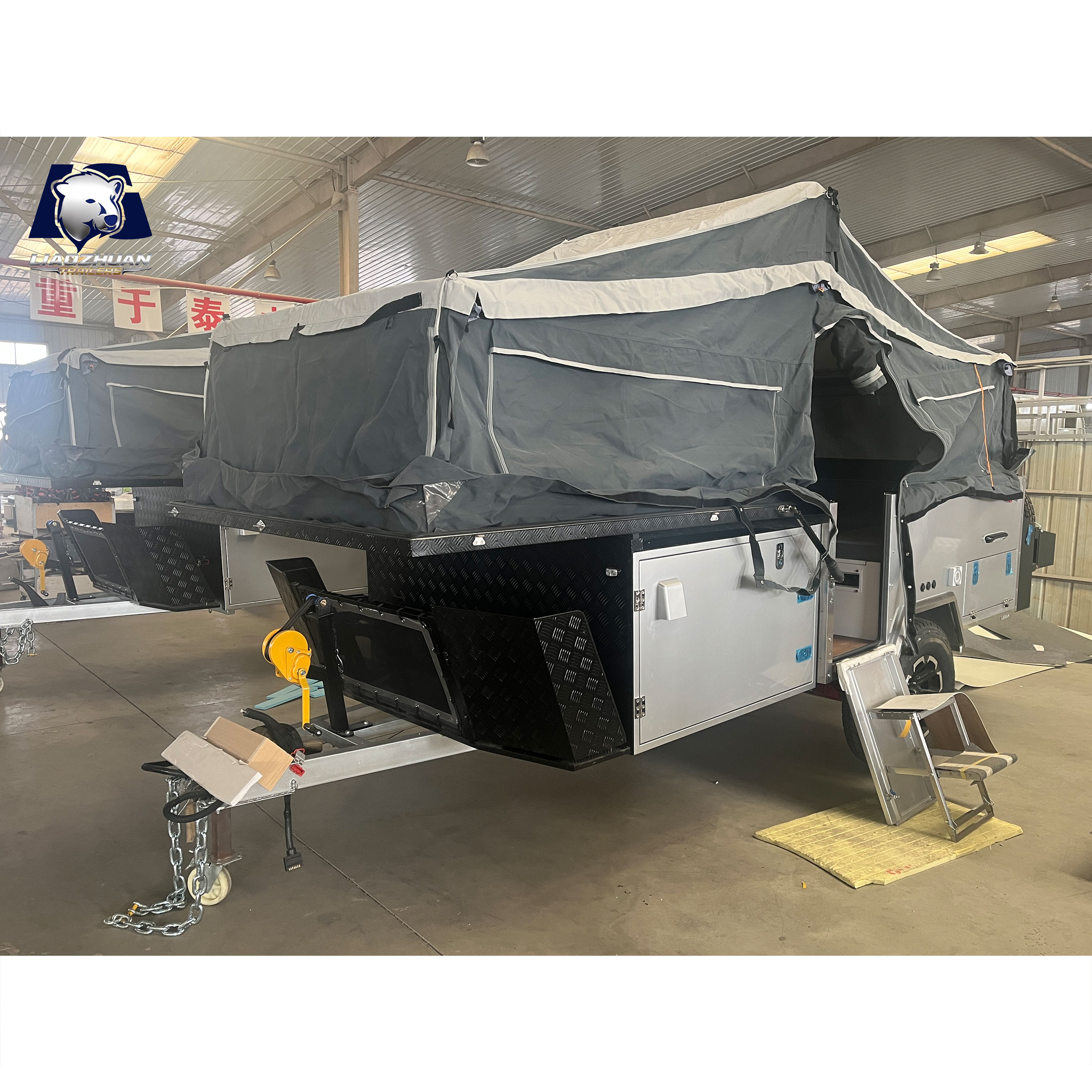 Front-folding hard-floor camping trailer