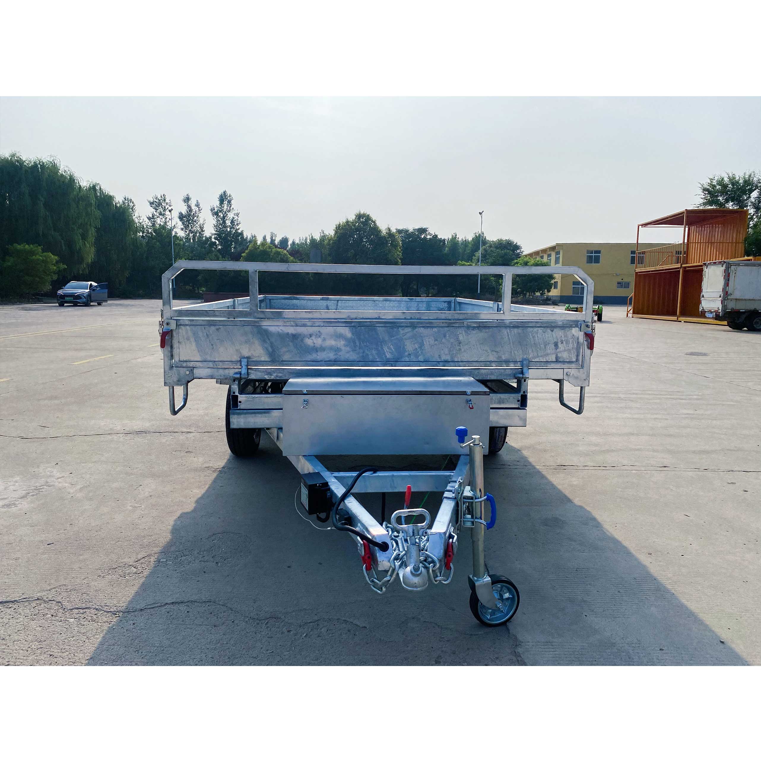 Series-connected dual-axis self-unloading hydraulic trailer