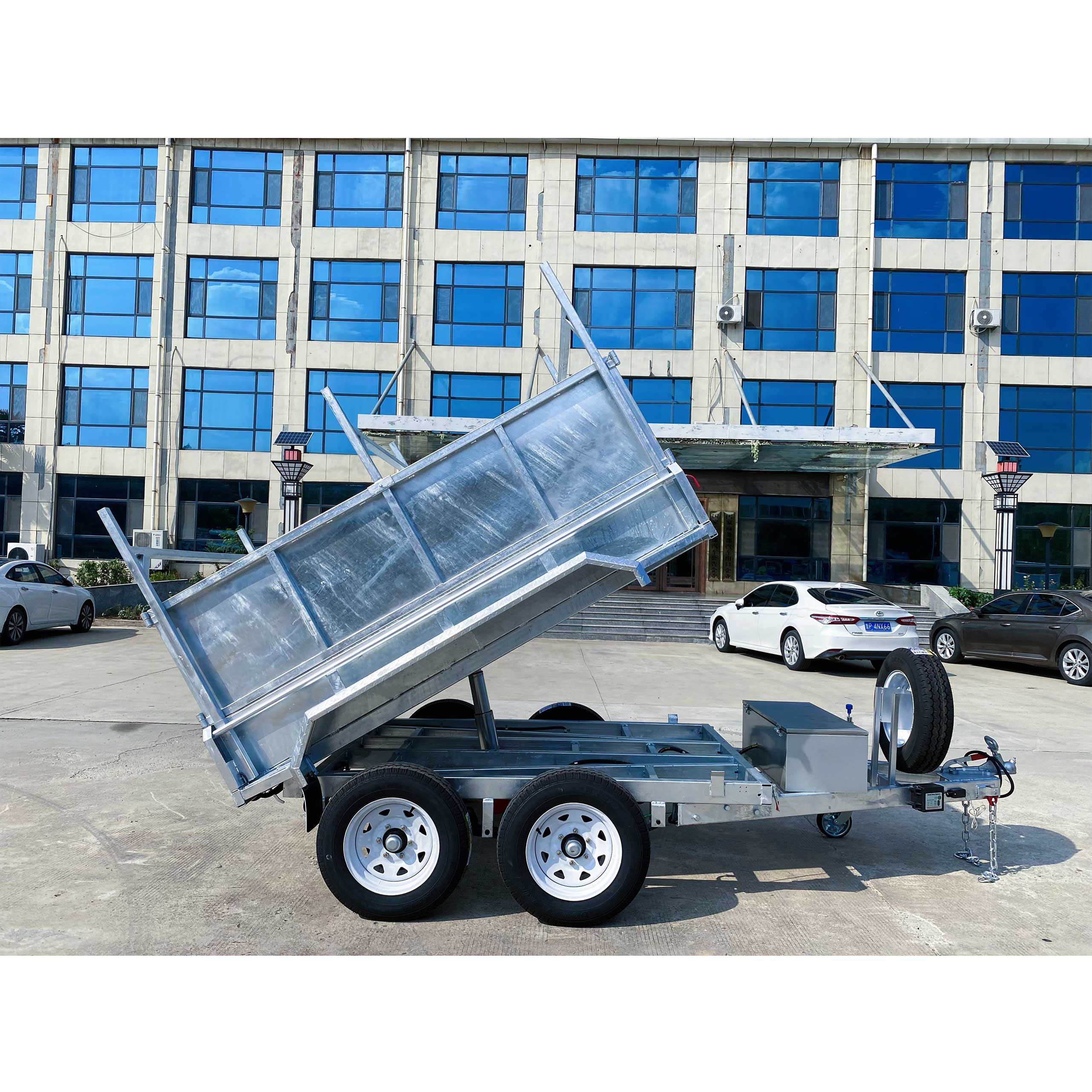 Double-axis dump box trailer