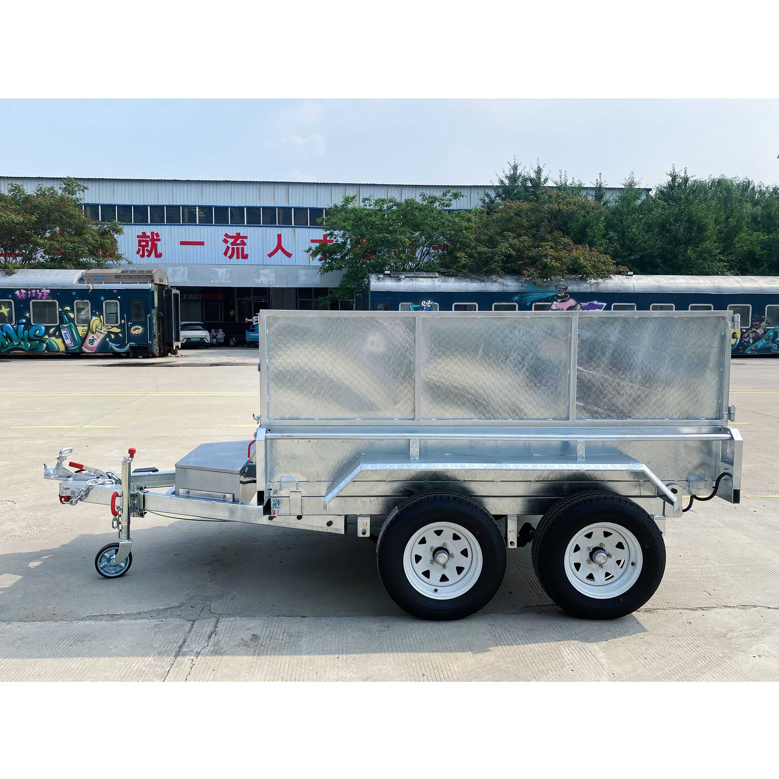Double-box type self-unloading hydraulic agricultural trailer