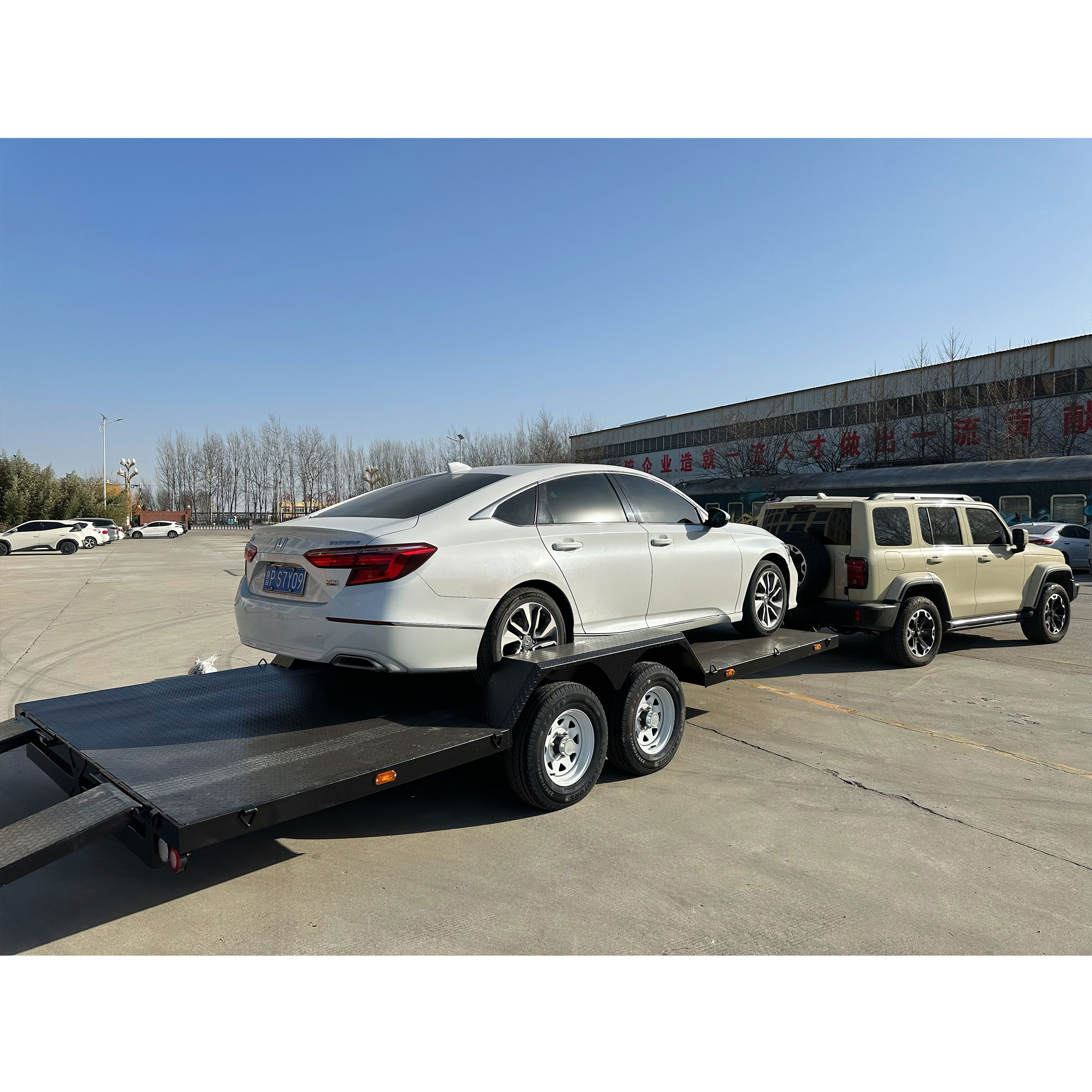 Dual-axle black painted car trailer