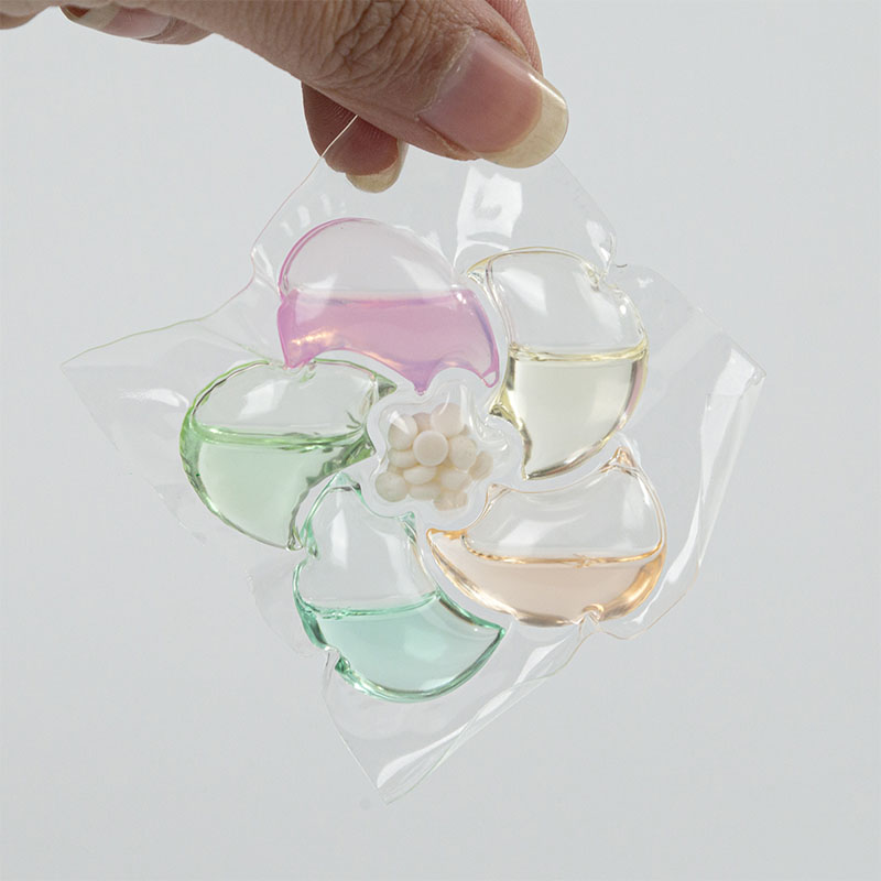 Капсула стирального порошка 6D, с розовым, зелёным, синим, оранжевым и жёлтым цветами