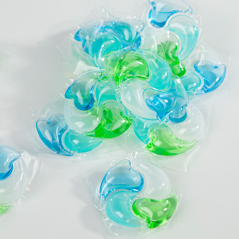 Laundry detergent pod 4D, green, blue, white