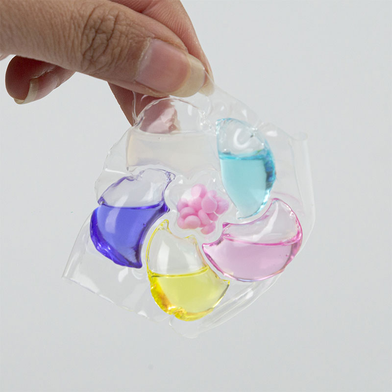 Laundry detergent pod 6D, purple, yellow, pink, blue, white