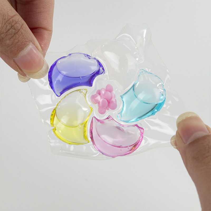 Laundry detergent pod 6D, purple, yellow, pink, blue, white