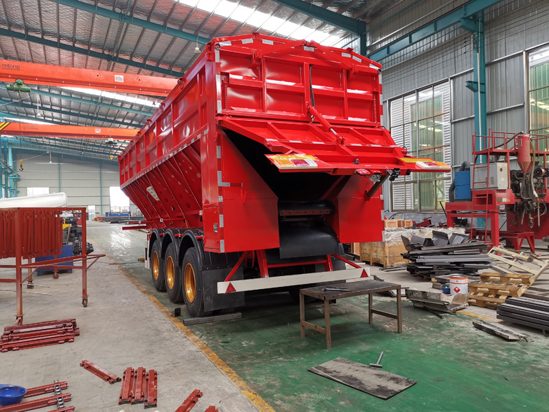 Tracked dump semi-trailer