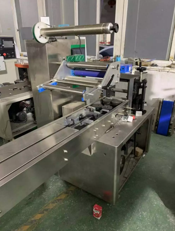 Pillow wrapping machine