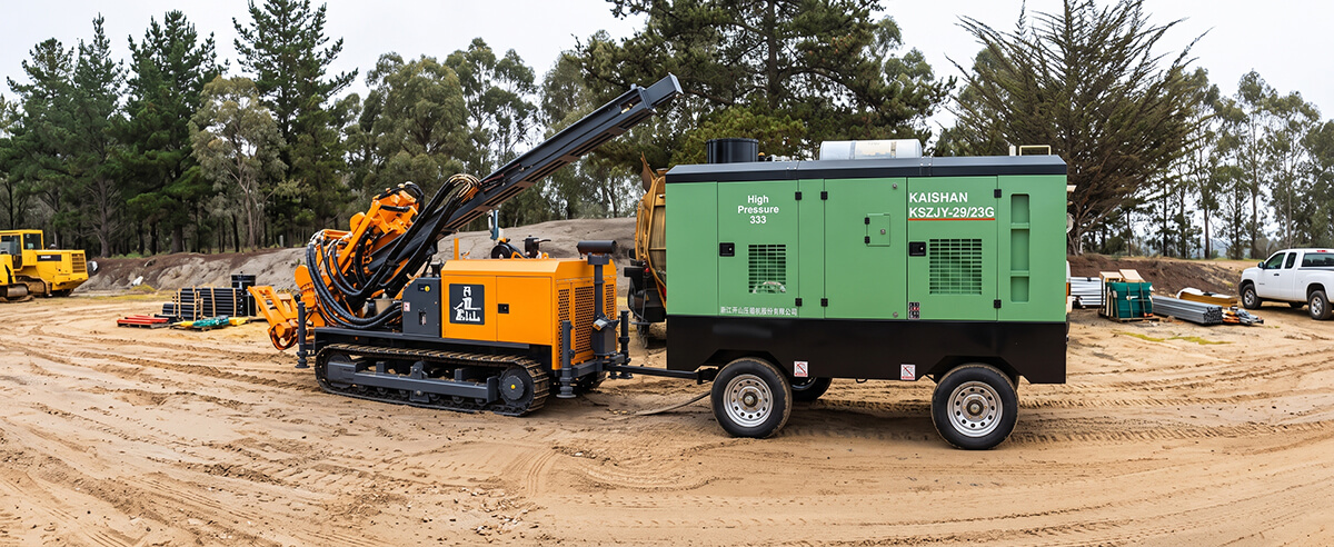 kaishan-portable-compressor-towed-by-crawler-dth-drill-rig